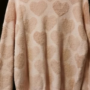 Pink sweater with hearts